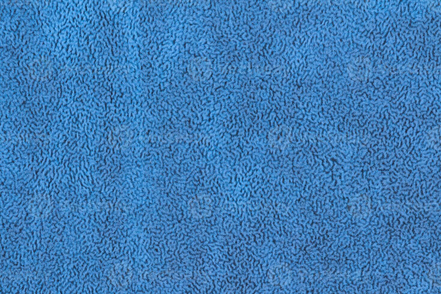 Blue color abstract fabric cloth with short pile fluffy, soft texture vivid background, copy space photo