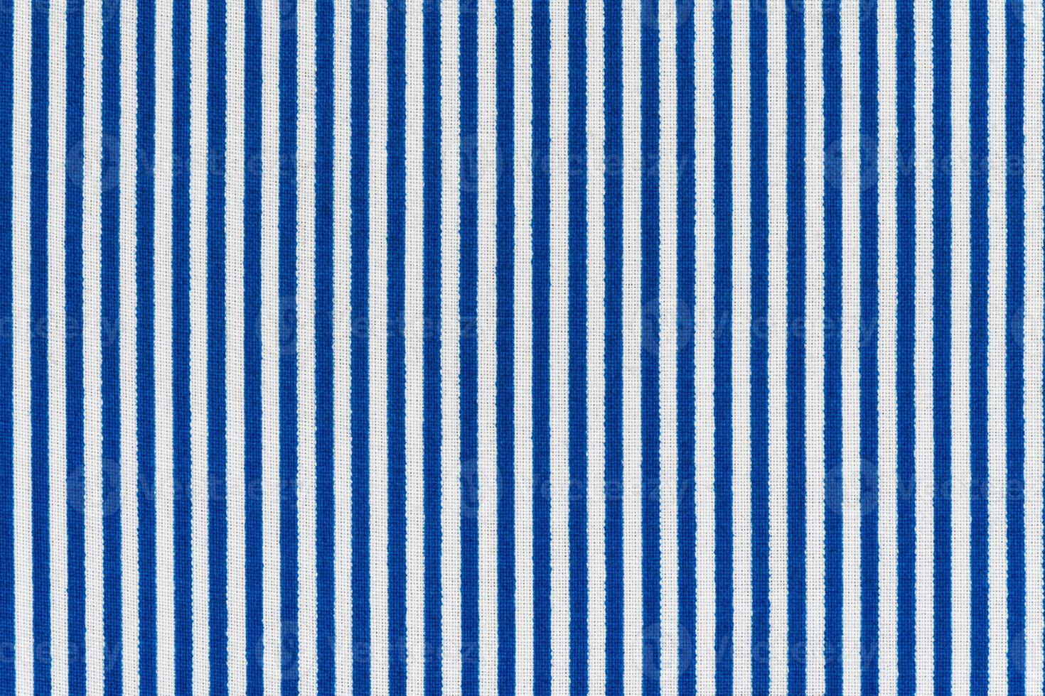 White and blue lines, striped abstract fabric texture background. Image of texture of colored cloth photo