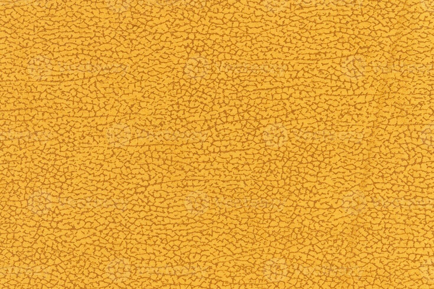 Yellow color abstract textile pattern background. Yellow colour fabric material, colored background photo