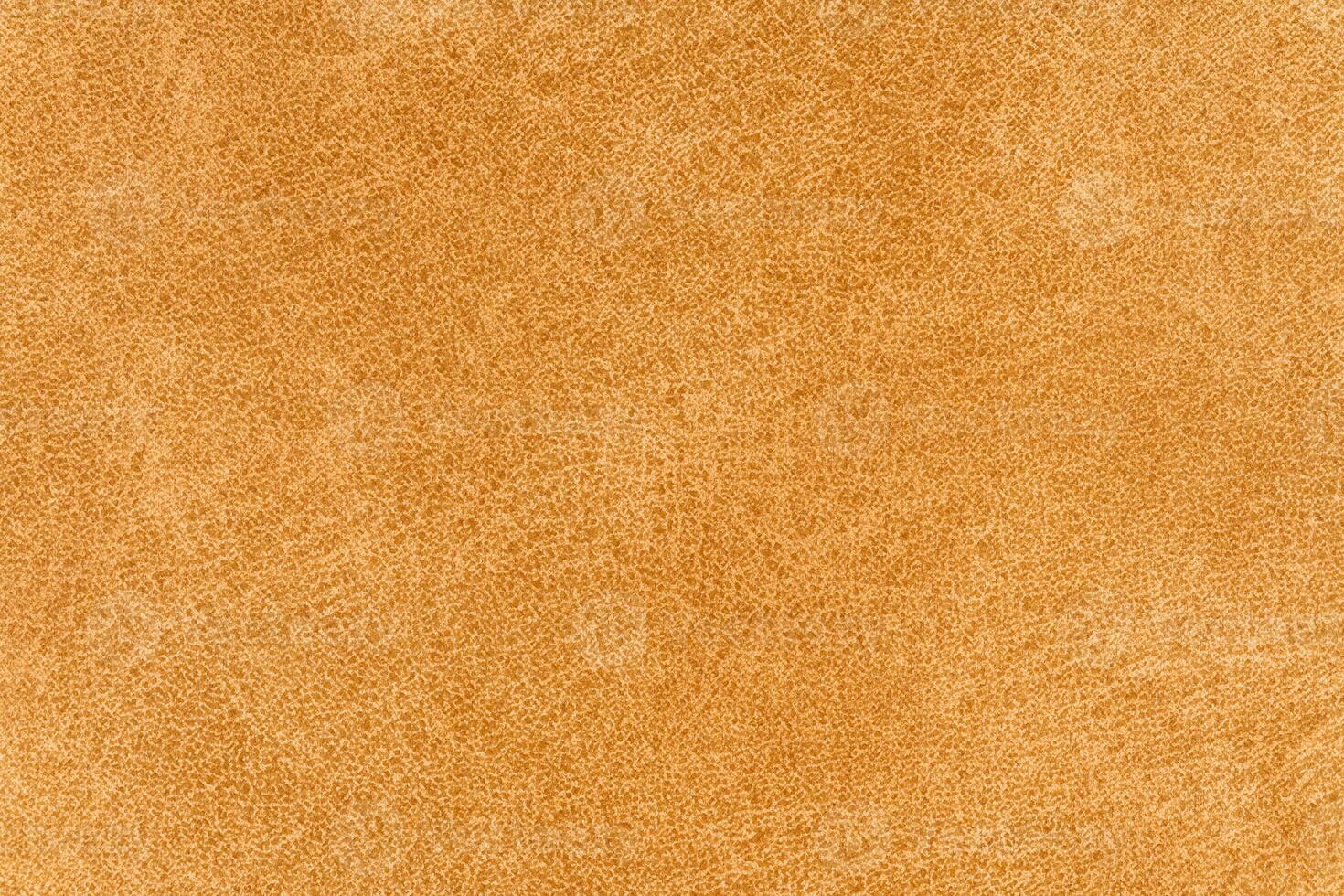Yellow color abstract textile pattern background. Fawn colour fabric material, colored background photo