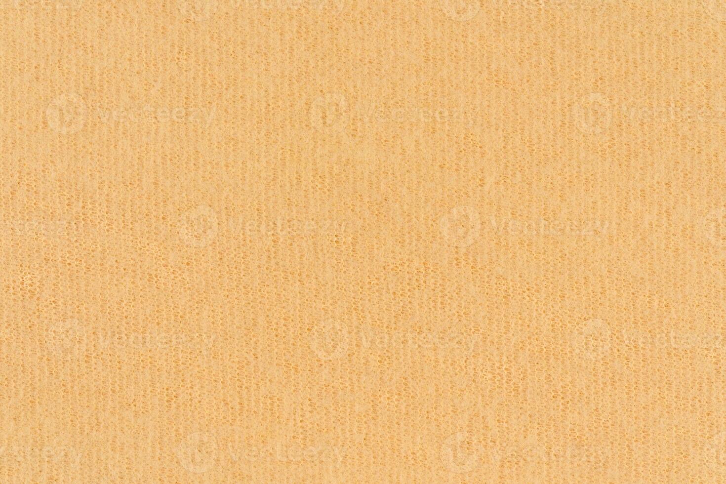 Yellow color wovenhand abstract textile pattern for background. Beige colour surface fabric material photo