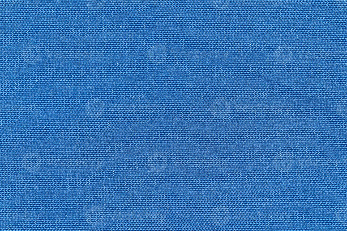 Blue color woven hand abstract fabric pattern for background. Plain blue surface textile material photo