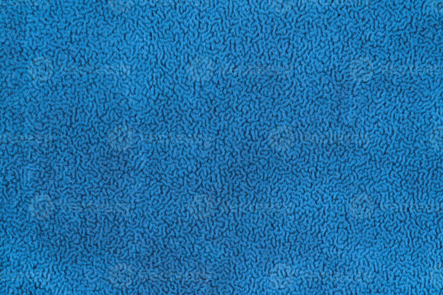 Blue color fabric cloth with short pile fluffy and soft abstract texture vivid background photo