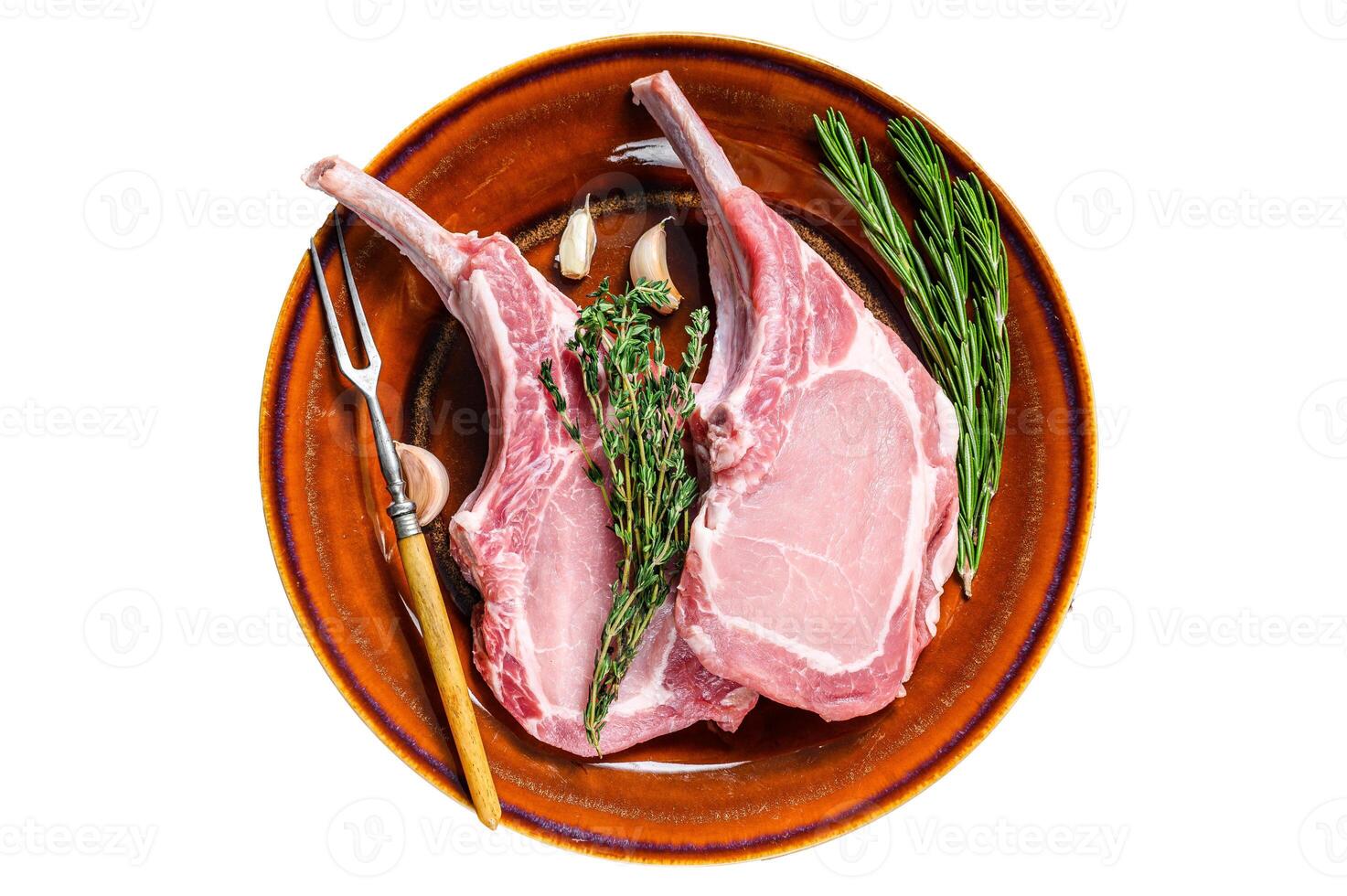 Raw pork chops meat steaks with pepper and salt. Isolated on white background. photo