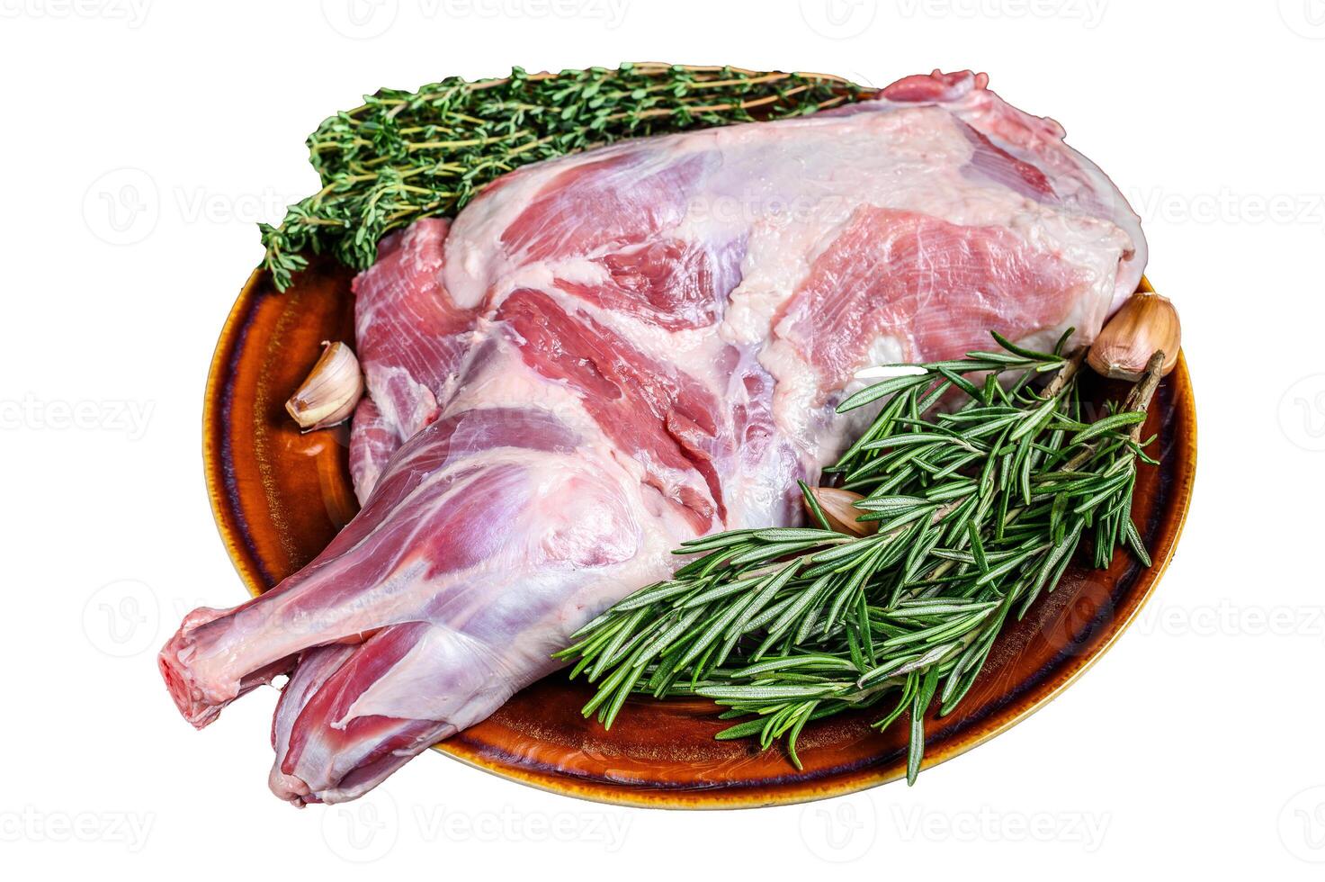 Whole fresh Raw goat shoulder meat on a plate. Isolated on white background. photo