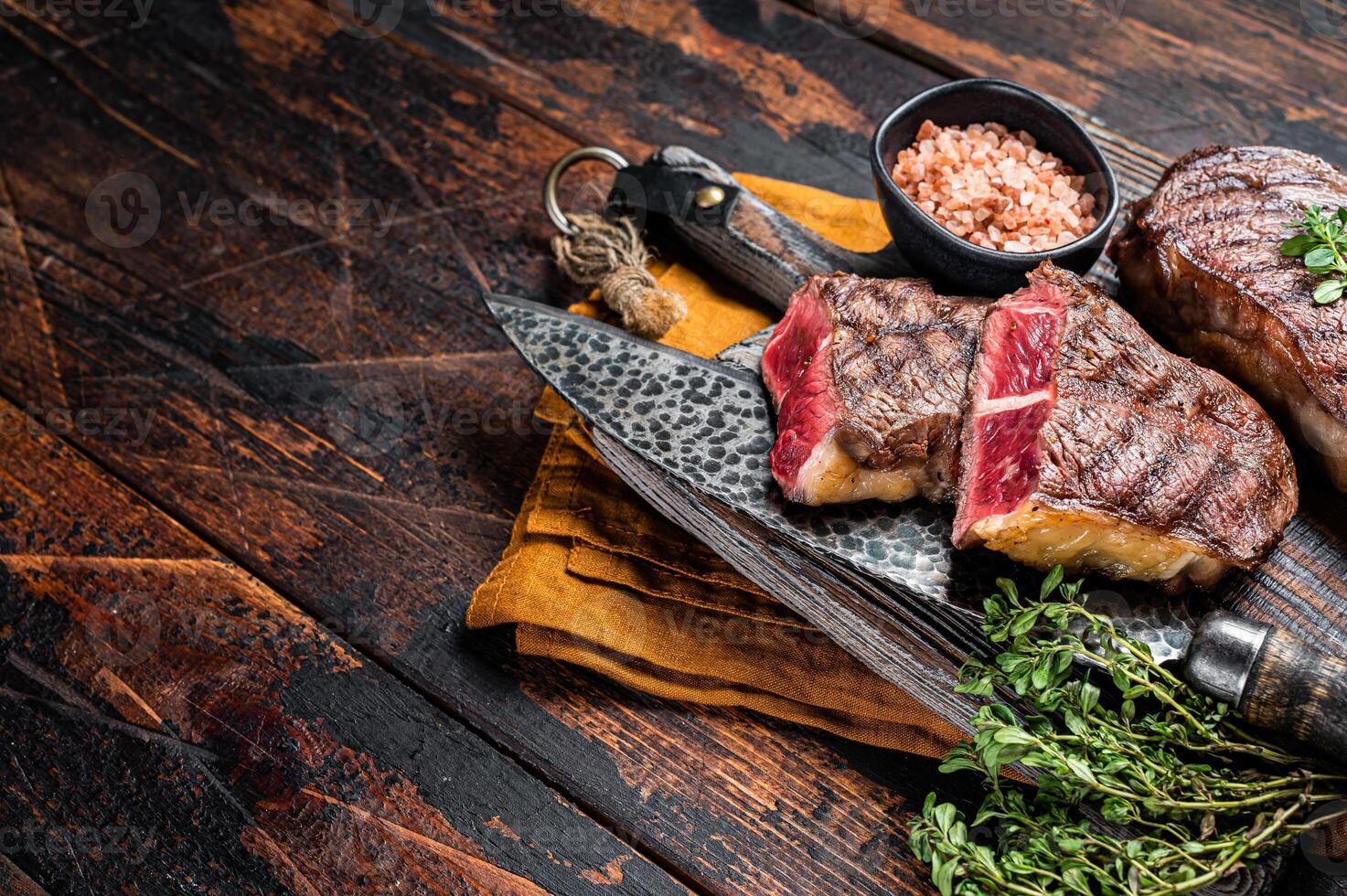 Oyster Top Blade beef meat steak grilled on summer BBQ. Wooden background. Top View. Copy space photo