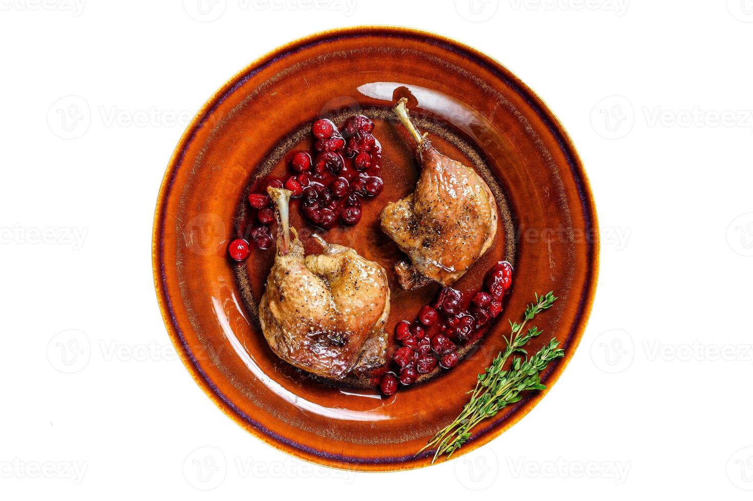 Roasted Christmas duck legs with cranberrie sauce. Isolated on white background. photo