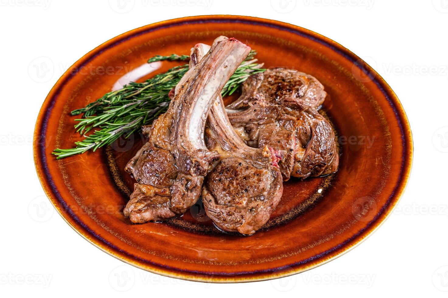 BBQ grilled lamb mutton meat chops steaks on a plate. Isolated on white background. photo