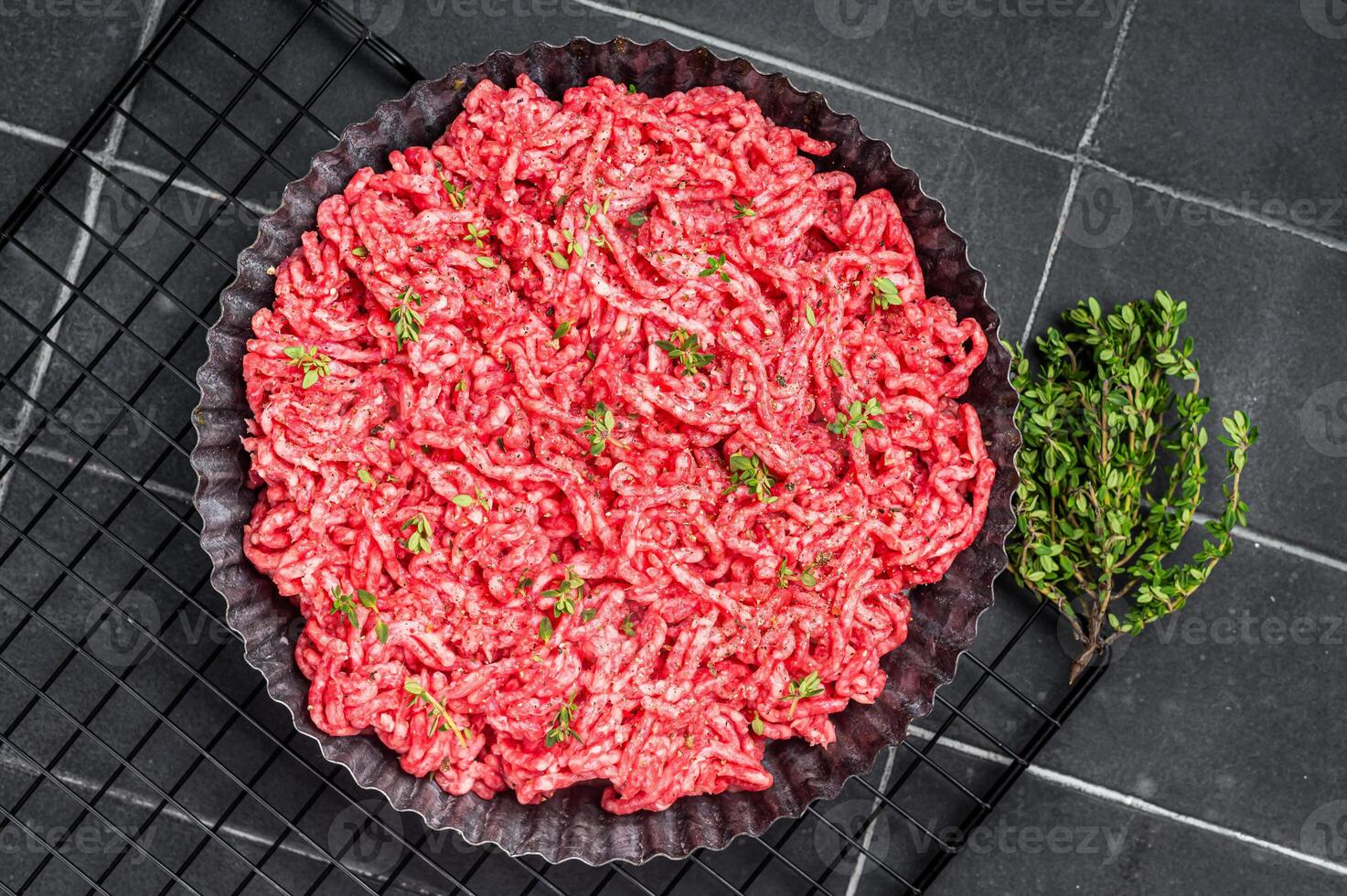 Raw Minced beef and pork meat for a burger patty or meatballs. Black background. Top view photo