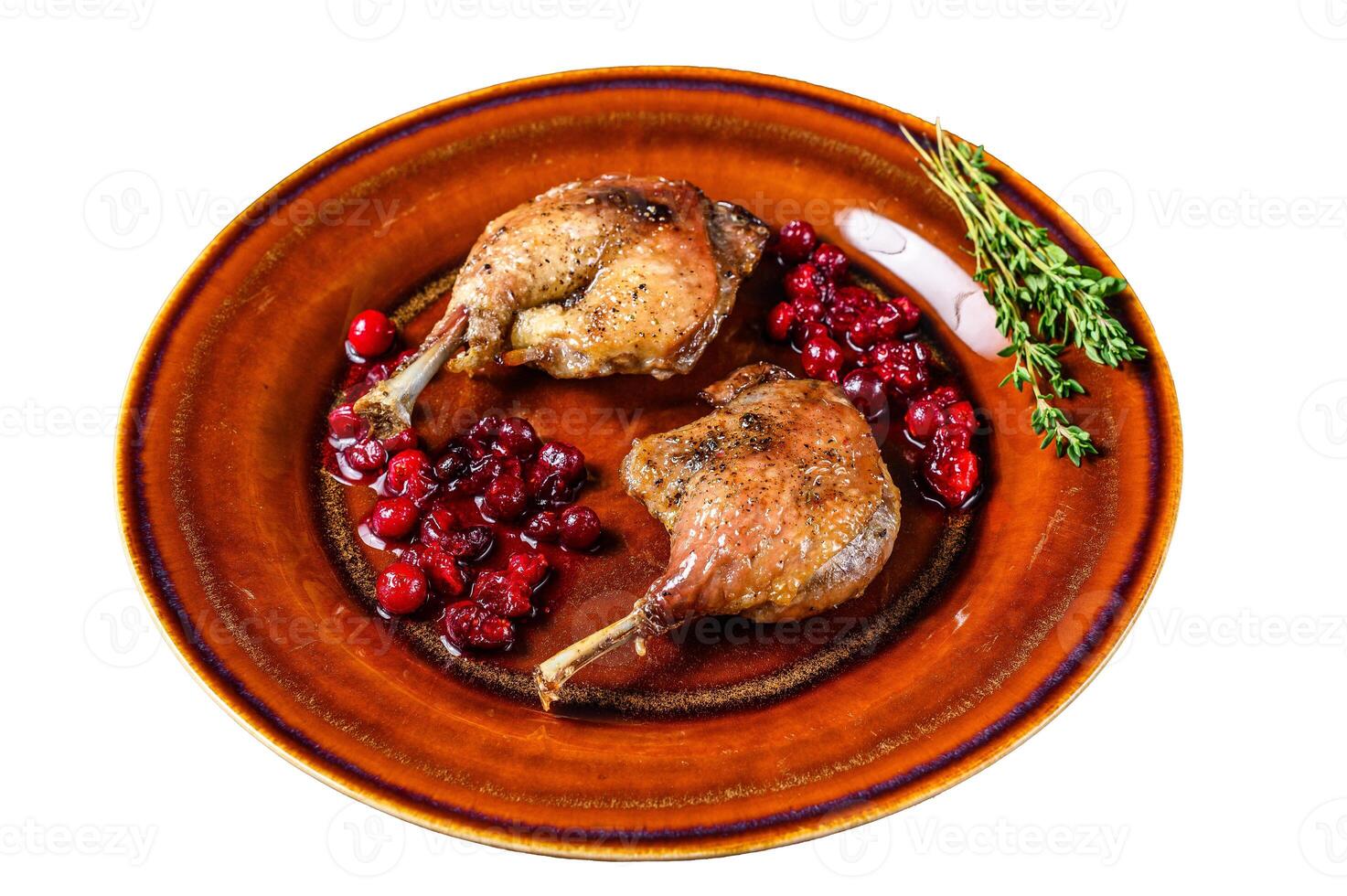 Roasted Christmas duck legs with cranberrie sauce. Isolated on white background. photo