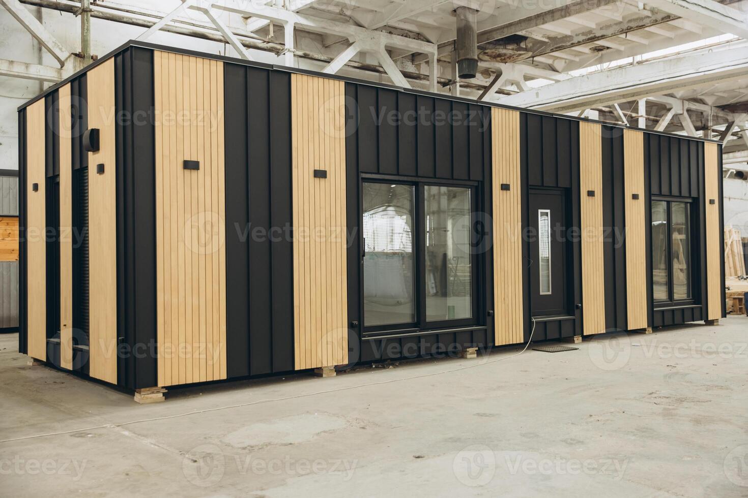 Modular building under construction in a large industrial facility photo
