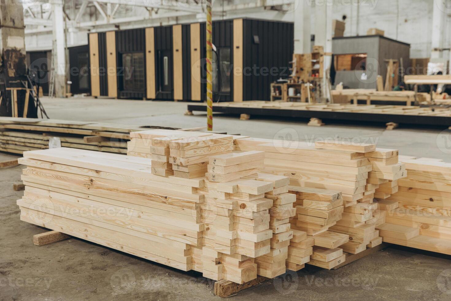 Wooden planks stacked in modular building construction factory photo