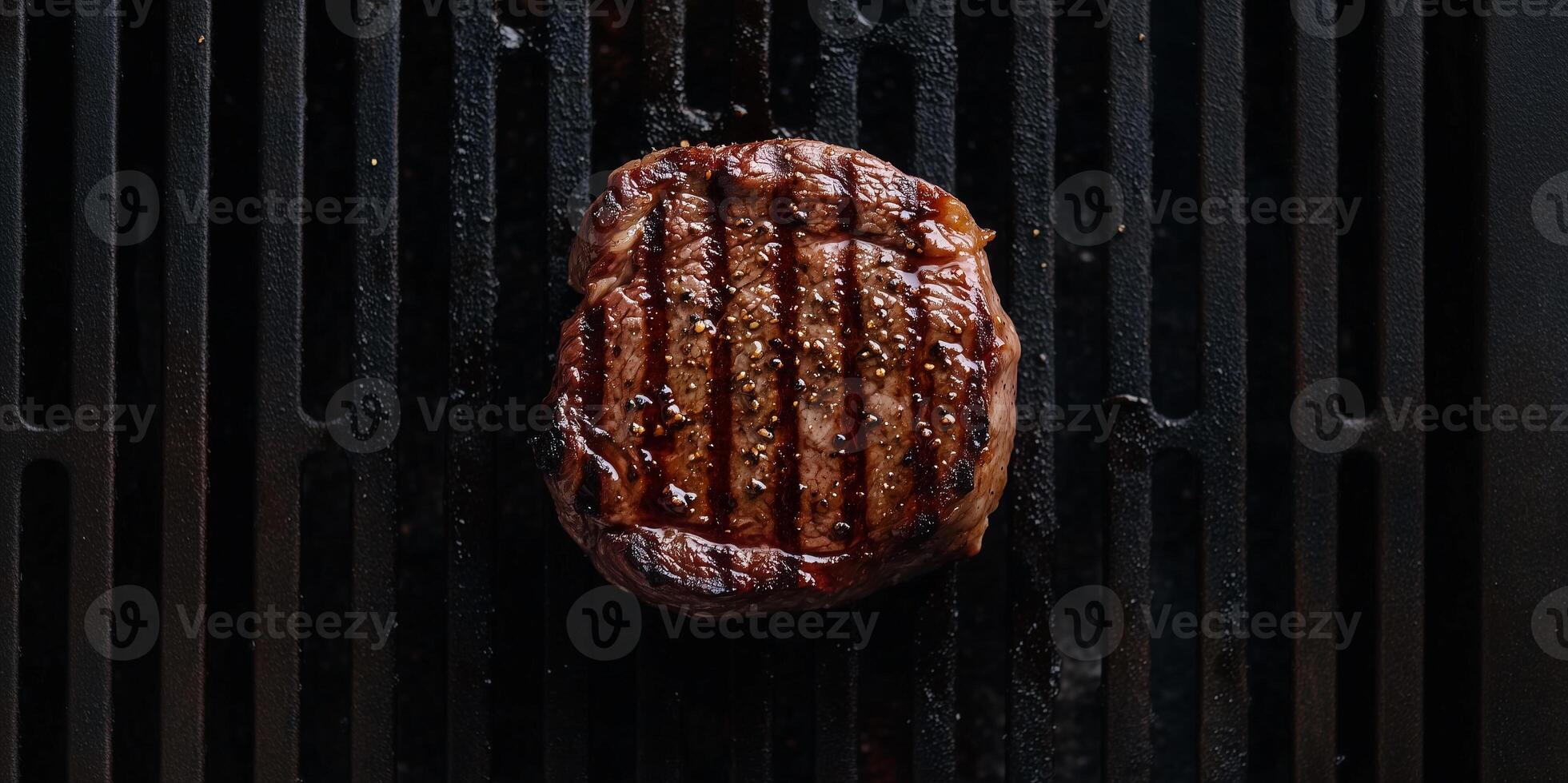 Filet mignon steak on a grill with visible sear marks, culinary photography photo