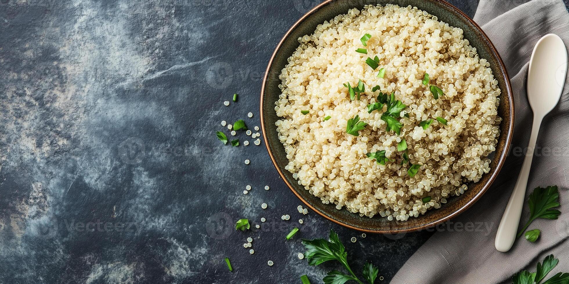Quinoa serving in a wide, shallow dish, with a plain utensil placed next to it, meal photography photo
