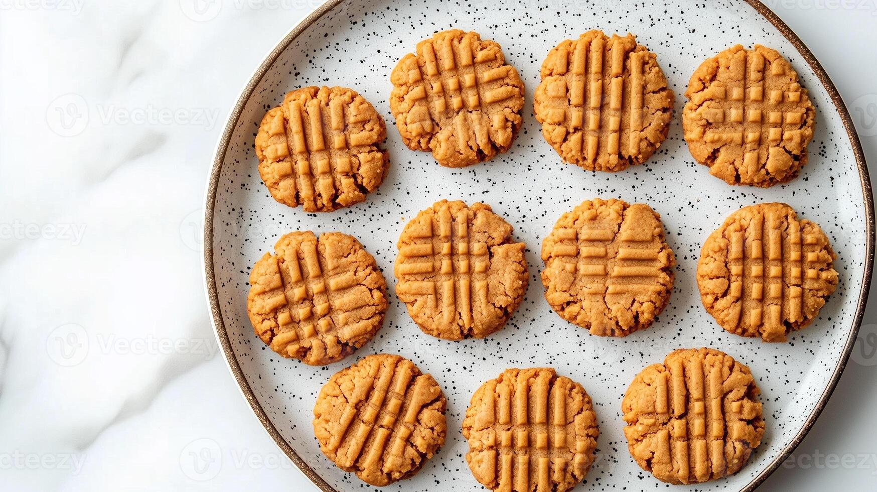 Collection of vegan peanut butter cookies laid out in a circular pattern on a plate, meal photography photo