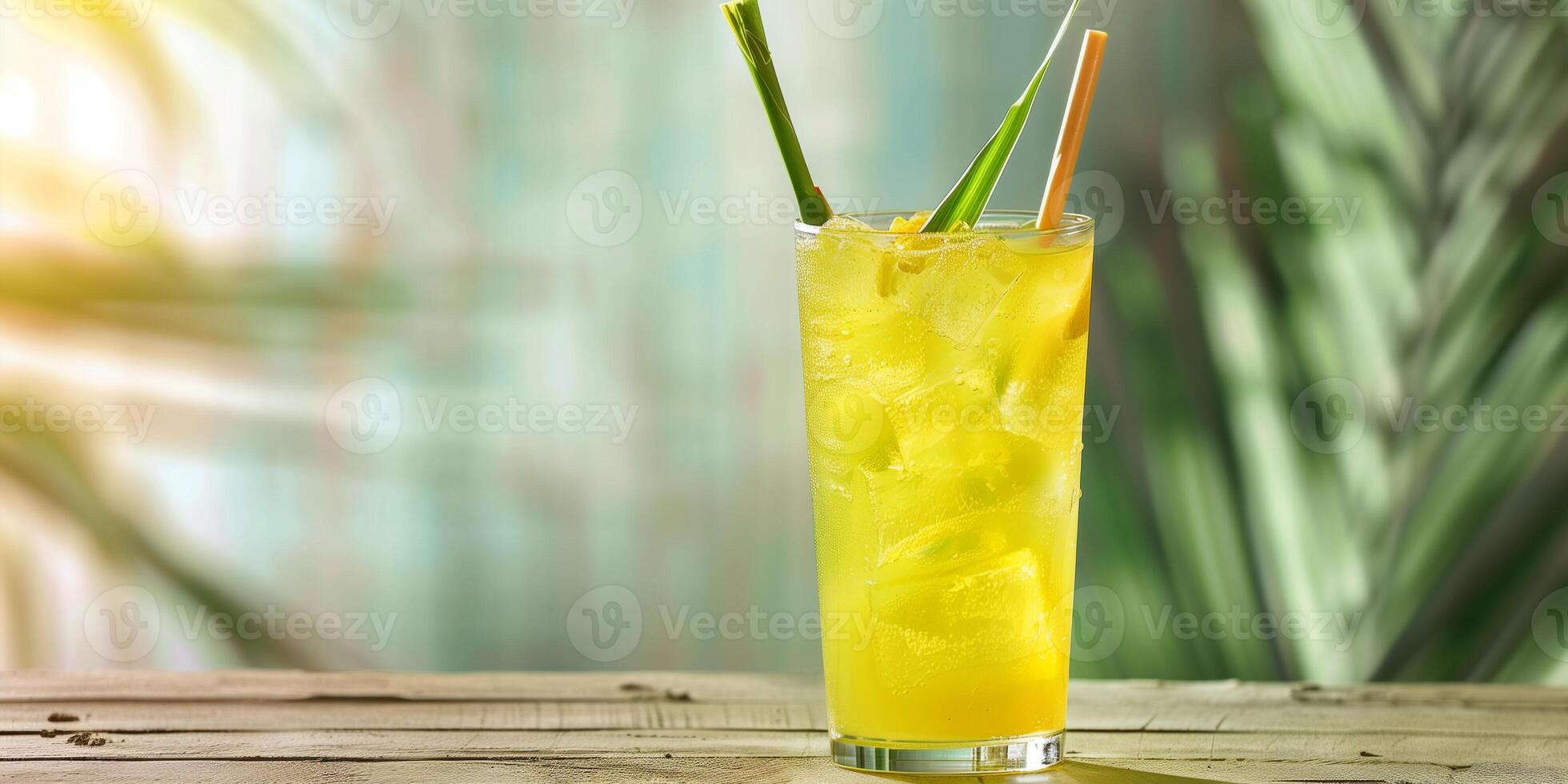 Tall glass with a yellow liquid, ice cubes, and a stick of lemongrass, meal photography photo
