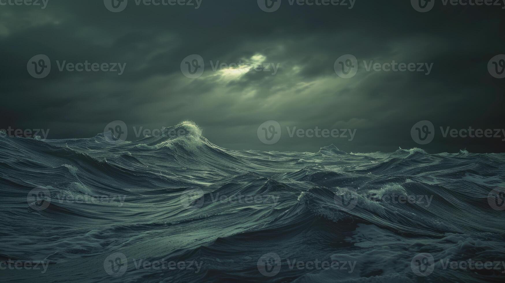 A dark ocean with waves and dark clouds photo