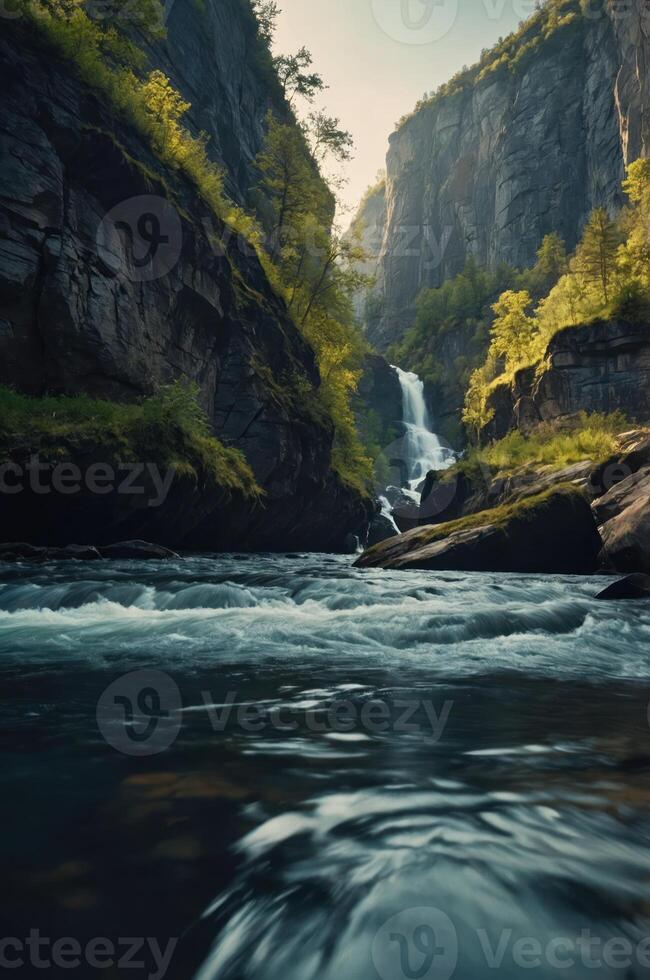 A serene waterfall cascading through a rocky gorge surrounded by lush greenery. photo