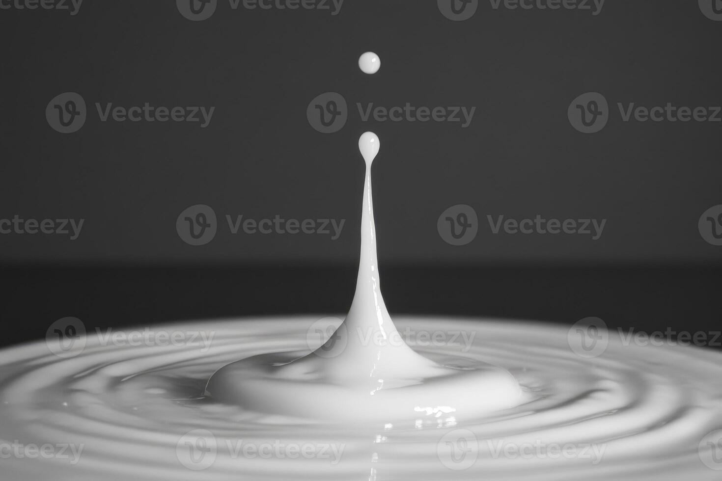 Milk Droplet Splashing and Creating Ripples photo
