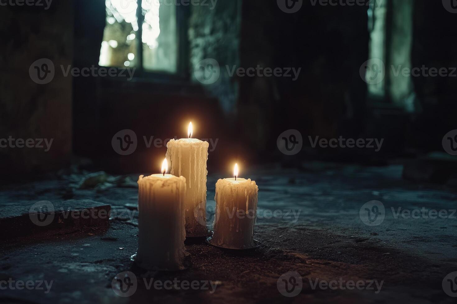 Three Lit Candles in a Dark Abandoned Building photo