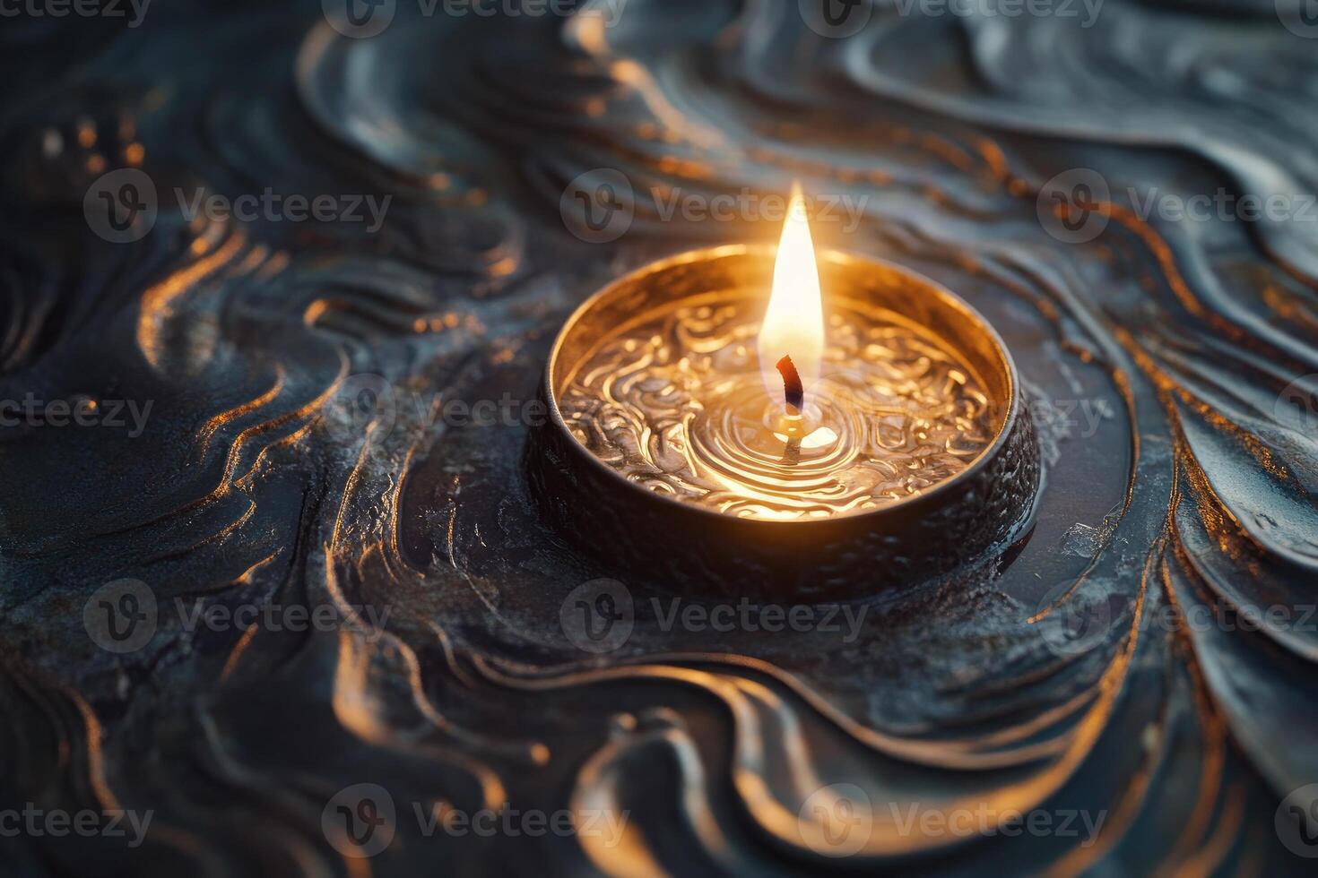 A Single Candle Flame in a Metallic Container with Water and Wavy Patterns photo