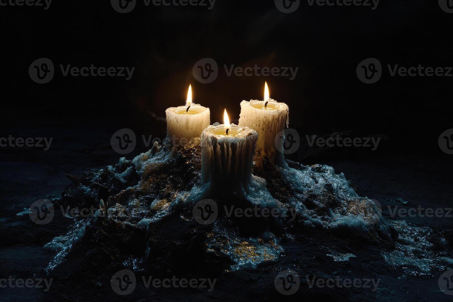 Three Burning Candles on a Pile of Wax photo