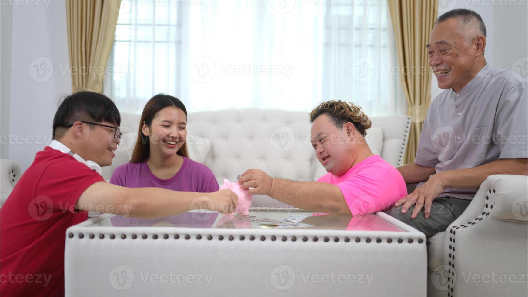 Three siblings save money by putting it in a piggy bank, This is an activity that parents teach their children about saving money photo