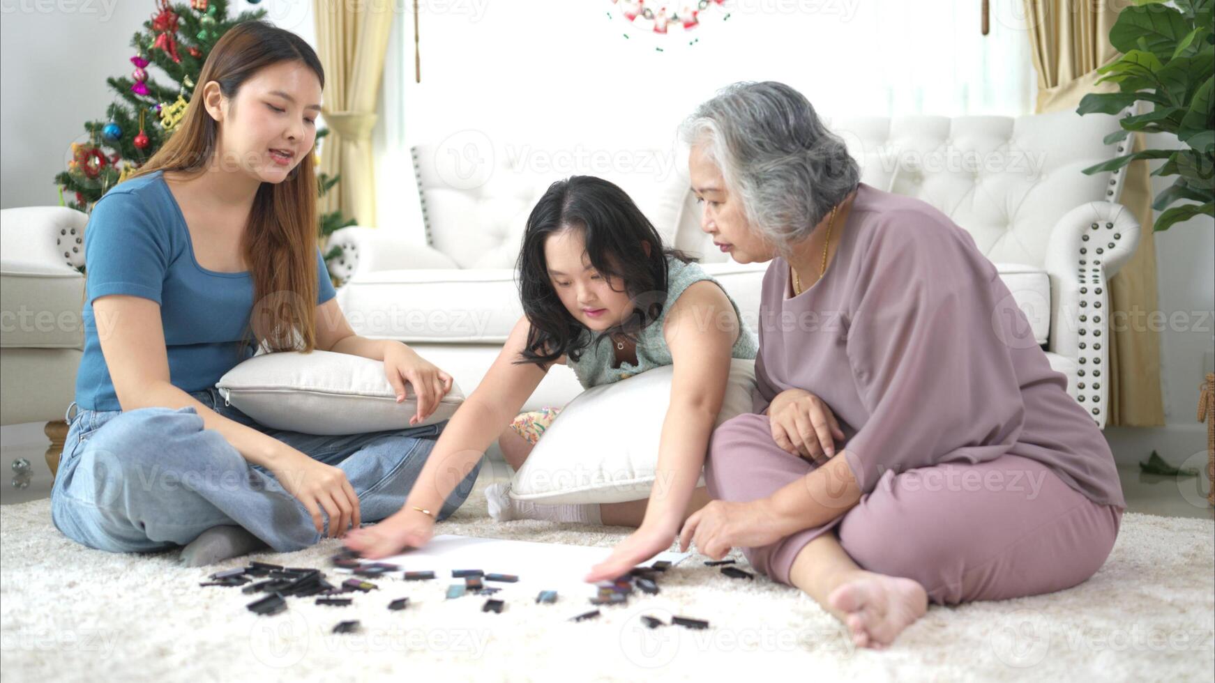 A family with an autistic child plays games together in the living room to relax during the holidays photo