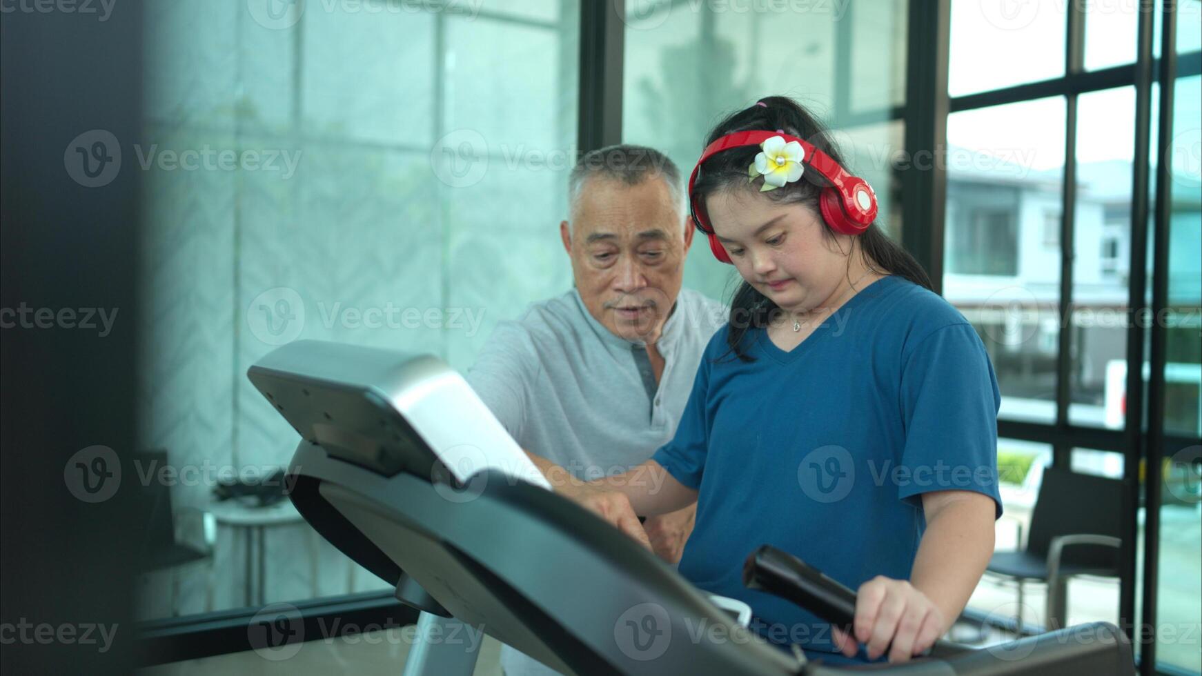 A family with an autistic child exercises together at the village clubhouse during the holidays photo