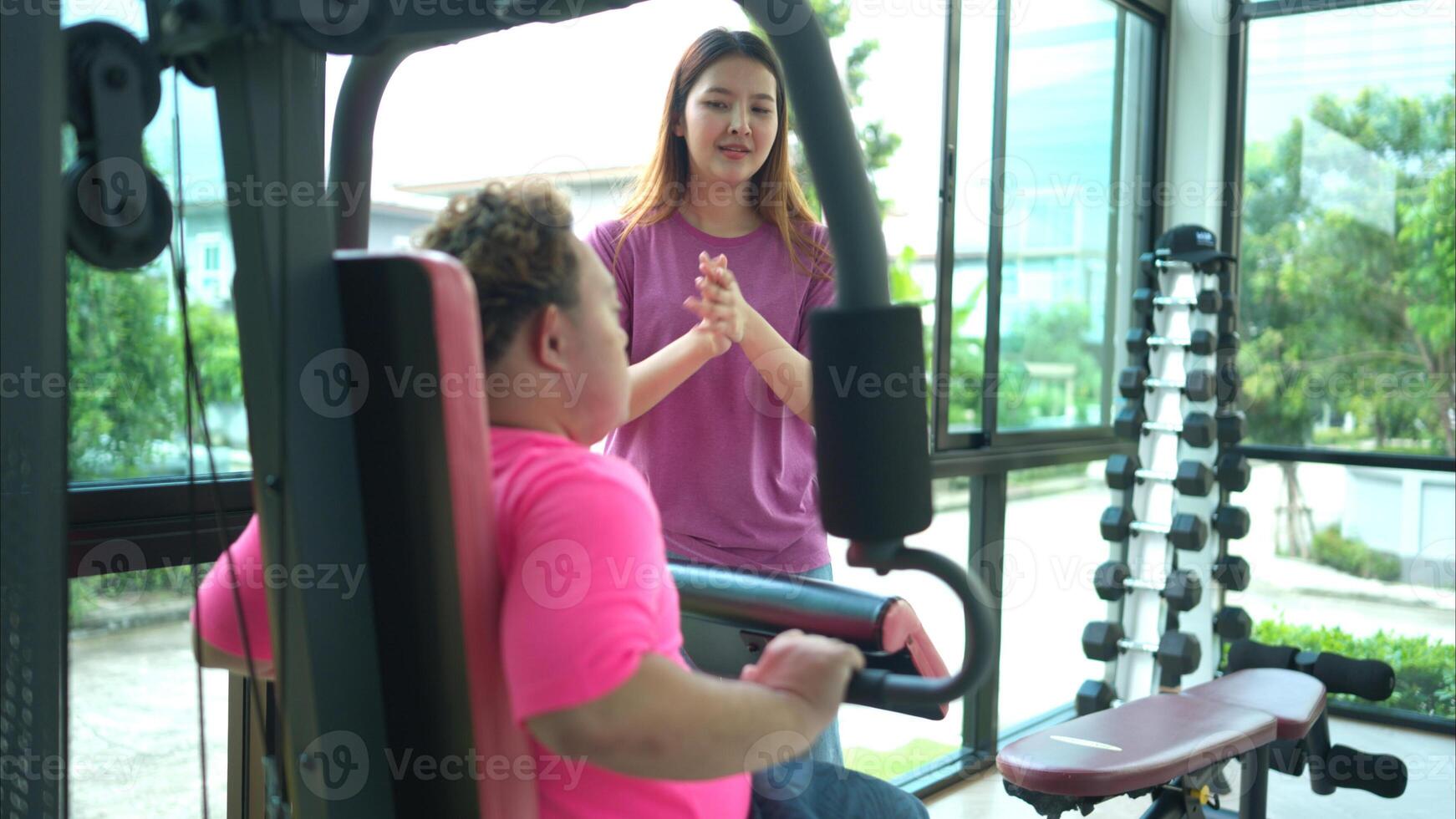 A family with an autistic child exercises together at the village clubhouse during the holidays photo
