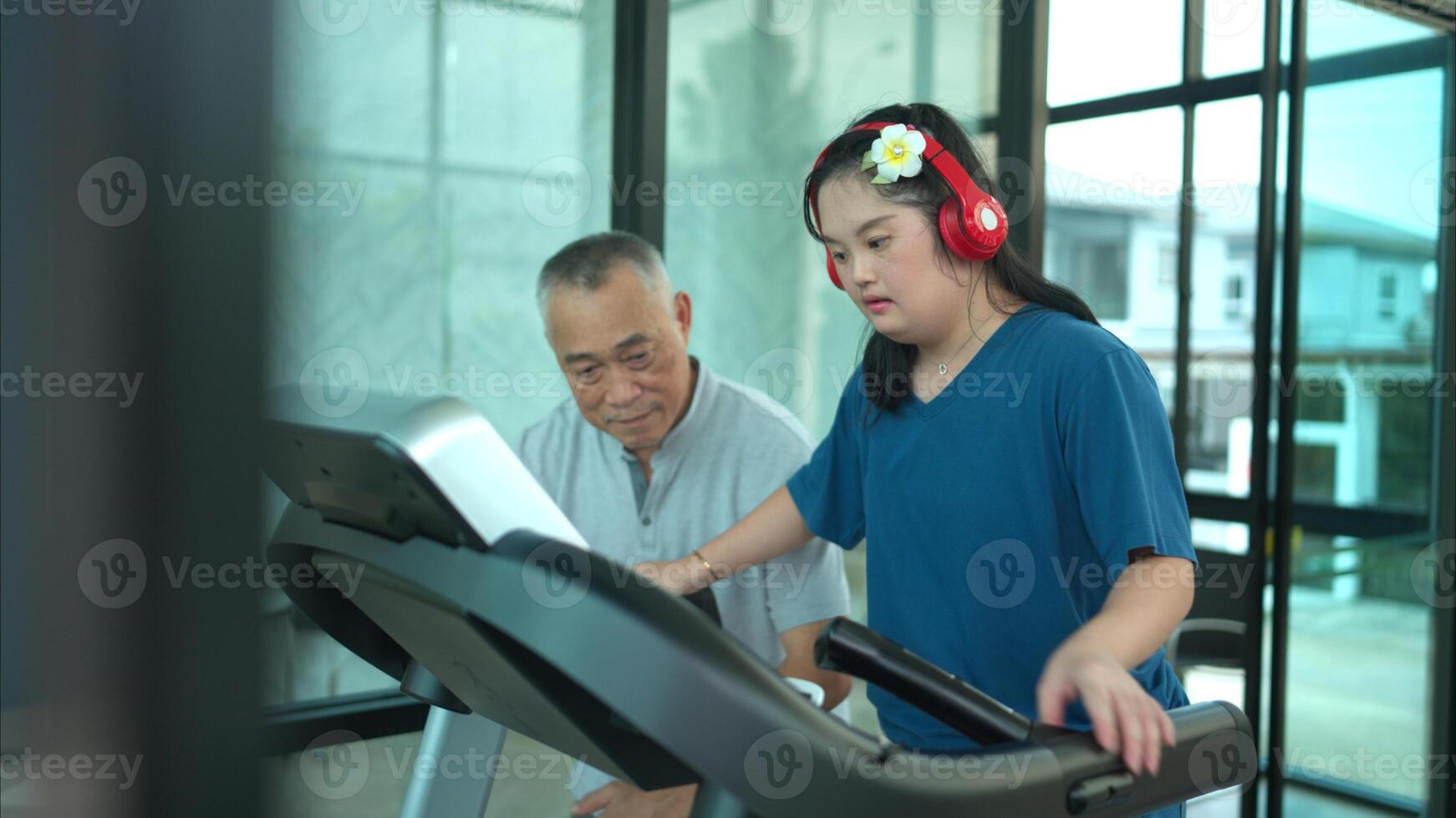 A family with an autistic child exercises together at the village clubhouse during the holidays photo