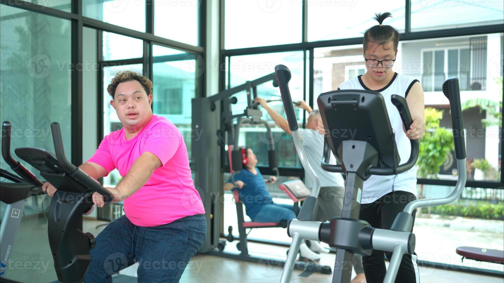 A family with an autistic child exercises together at the village clubhouse during the holidays photo