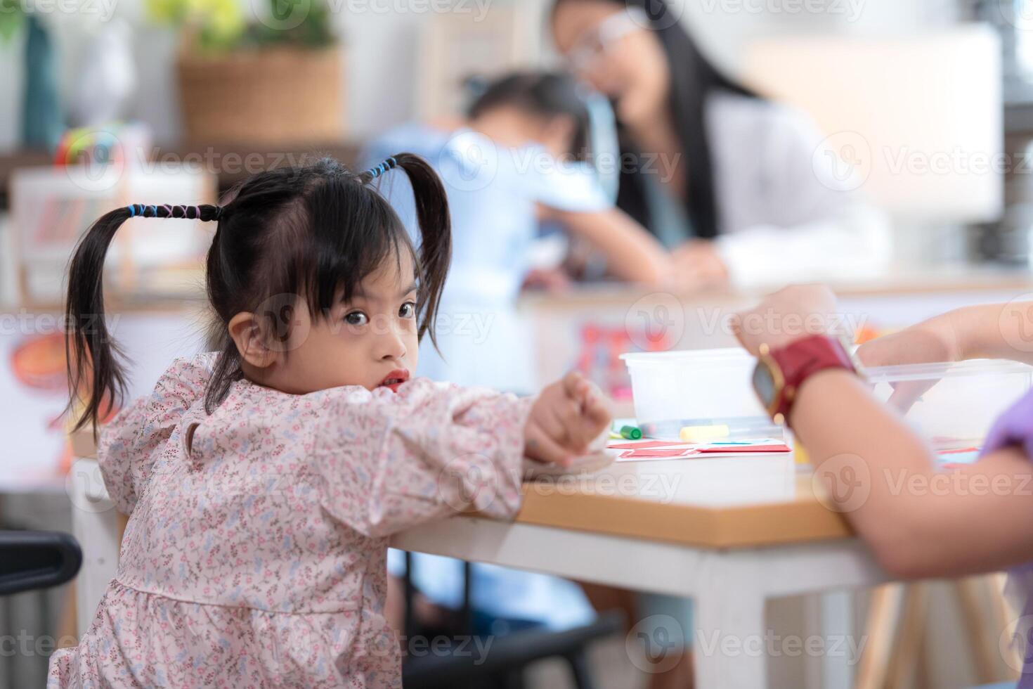 Portrait of special students doing learning activities in a special classroom photo