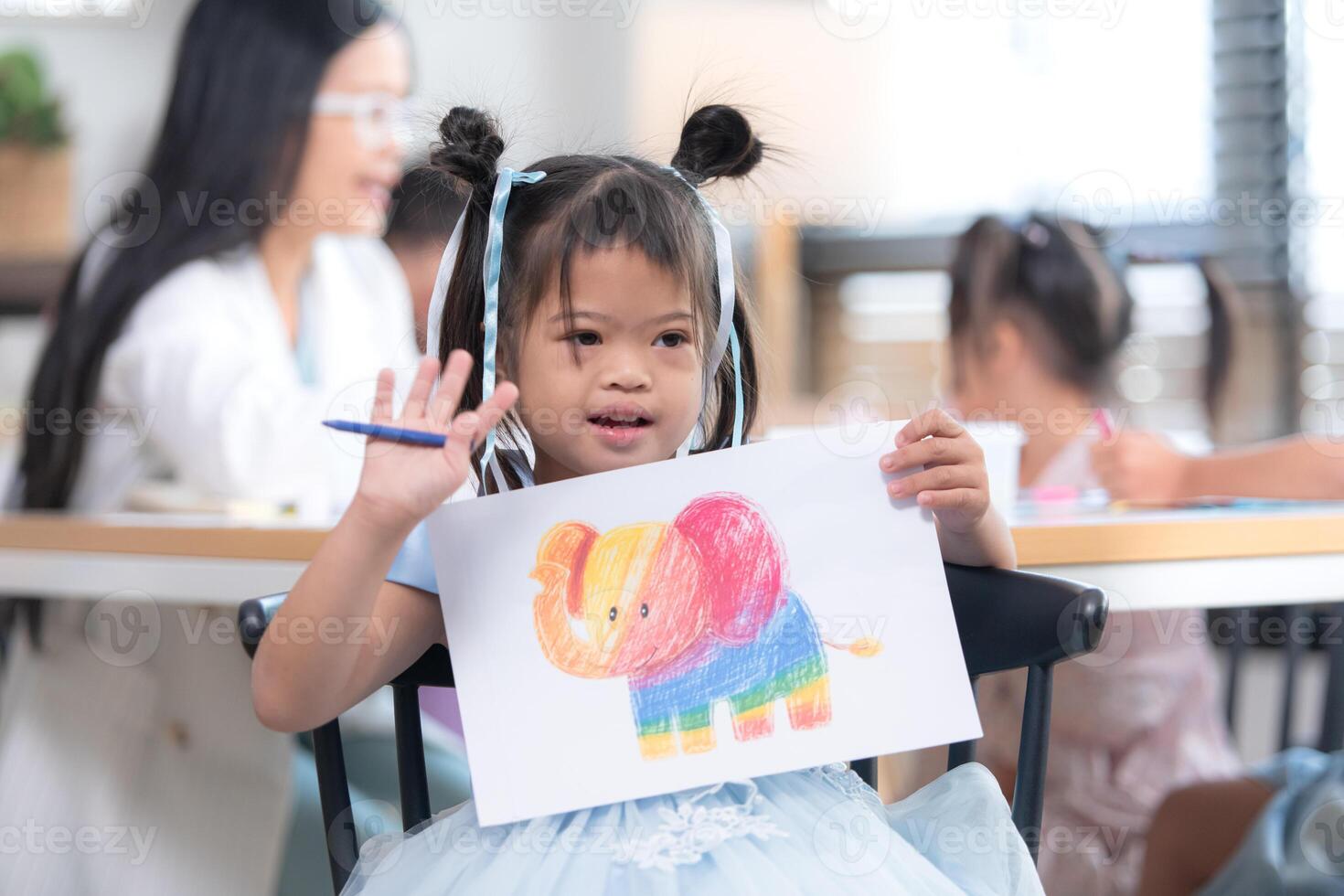 Portrait of special students doing learning activities in a special classroom photo