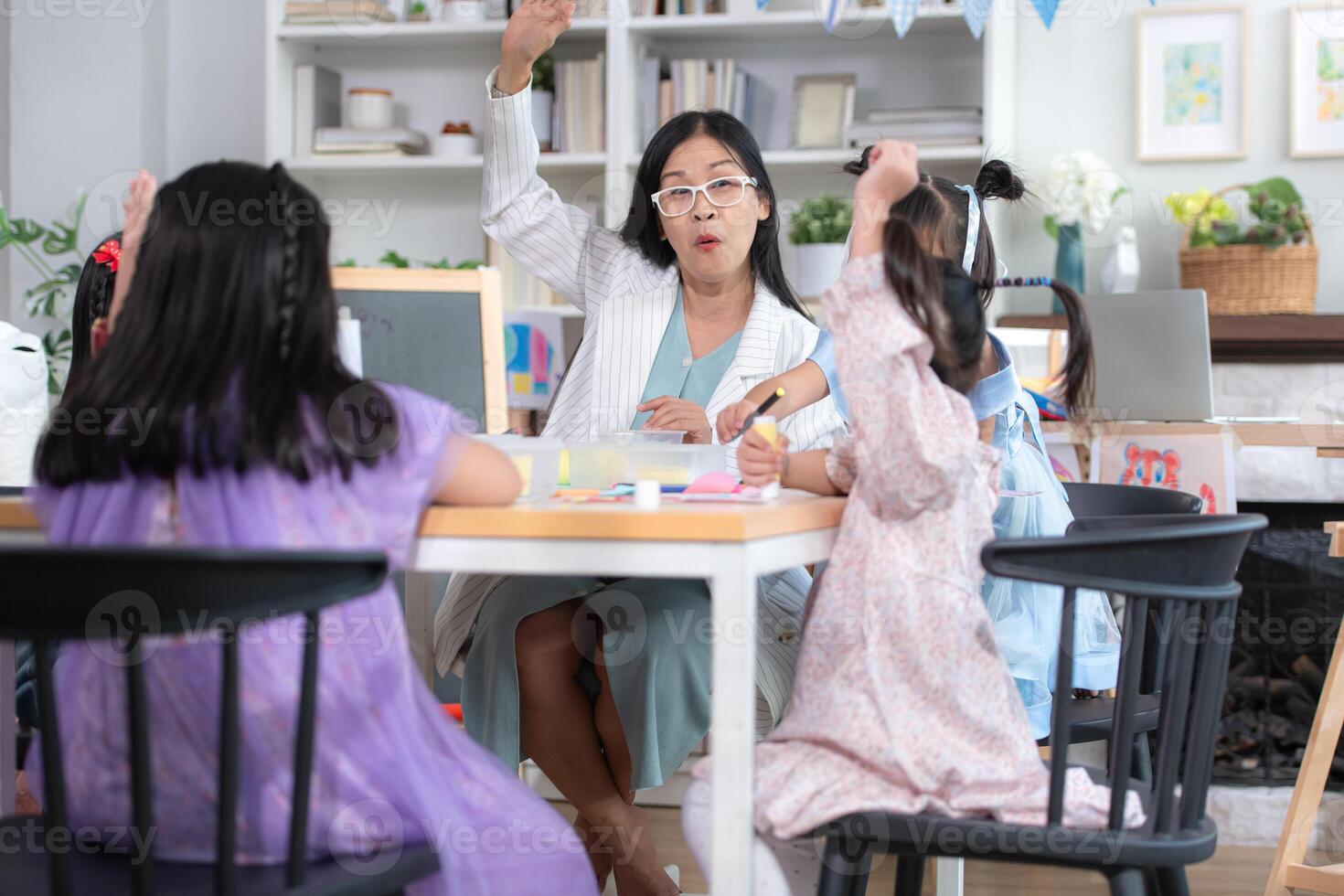 A group of special students doing learning activities in a special classroom photo