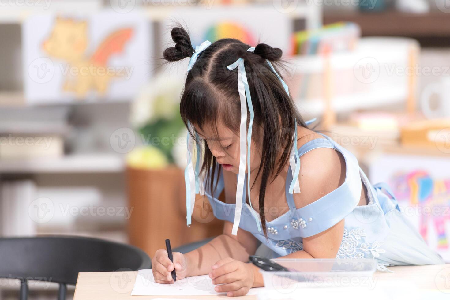 Portrait of special students doing learning activities in a special classroom photo