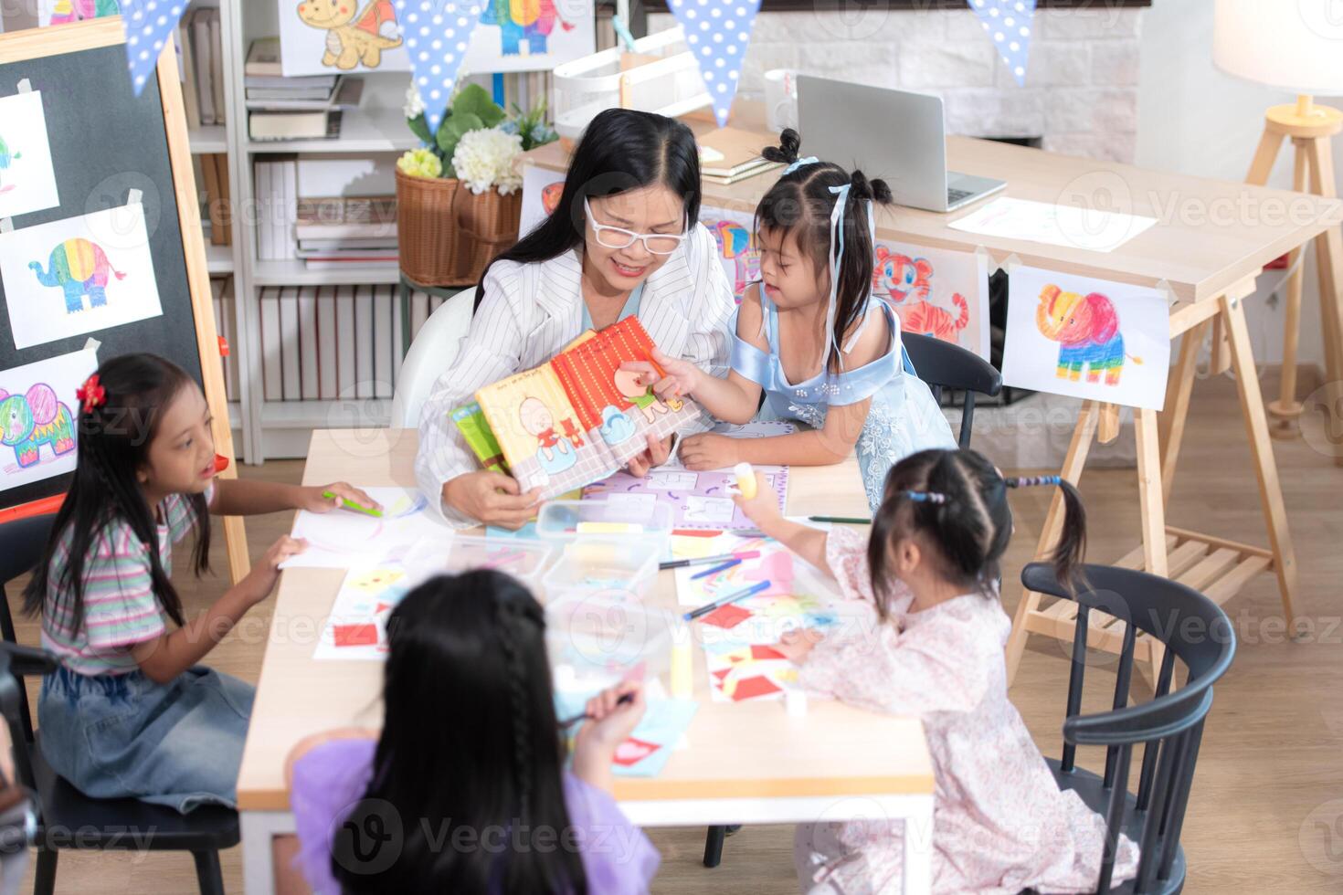 A group of special students doing learning activities in a special classroom photo