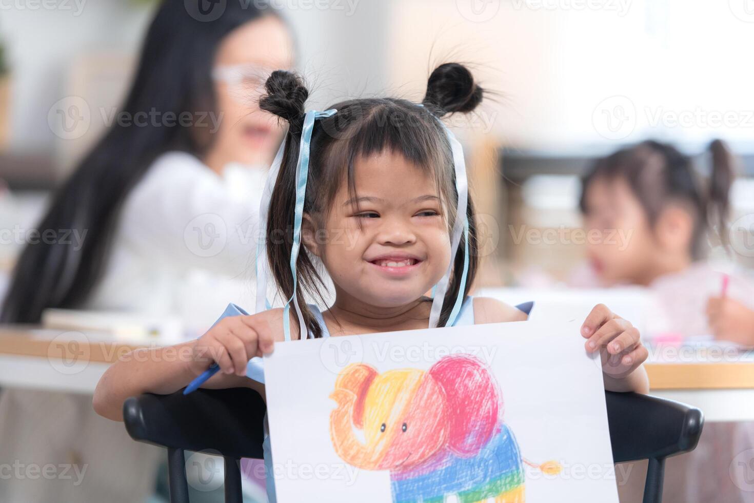 Portrait of special students doing learning activities in a special classroom photo