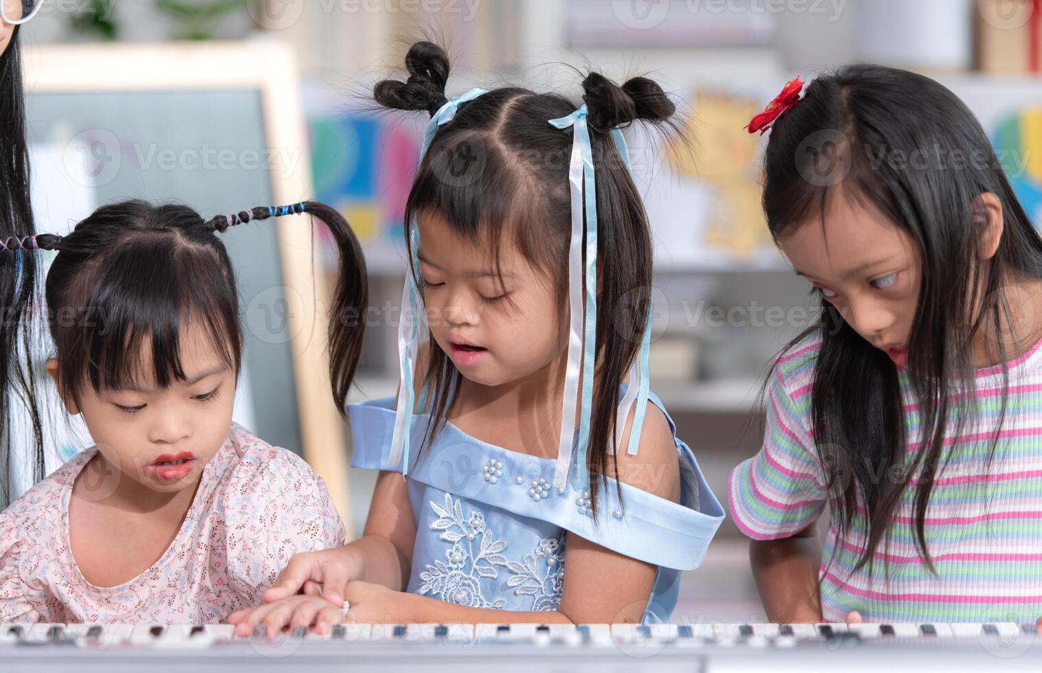 Portrait of special students doing learning activities in a special classroom photo