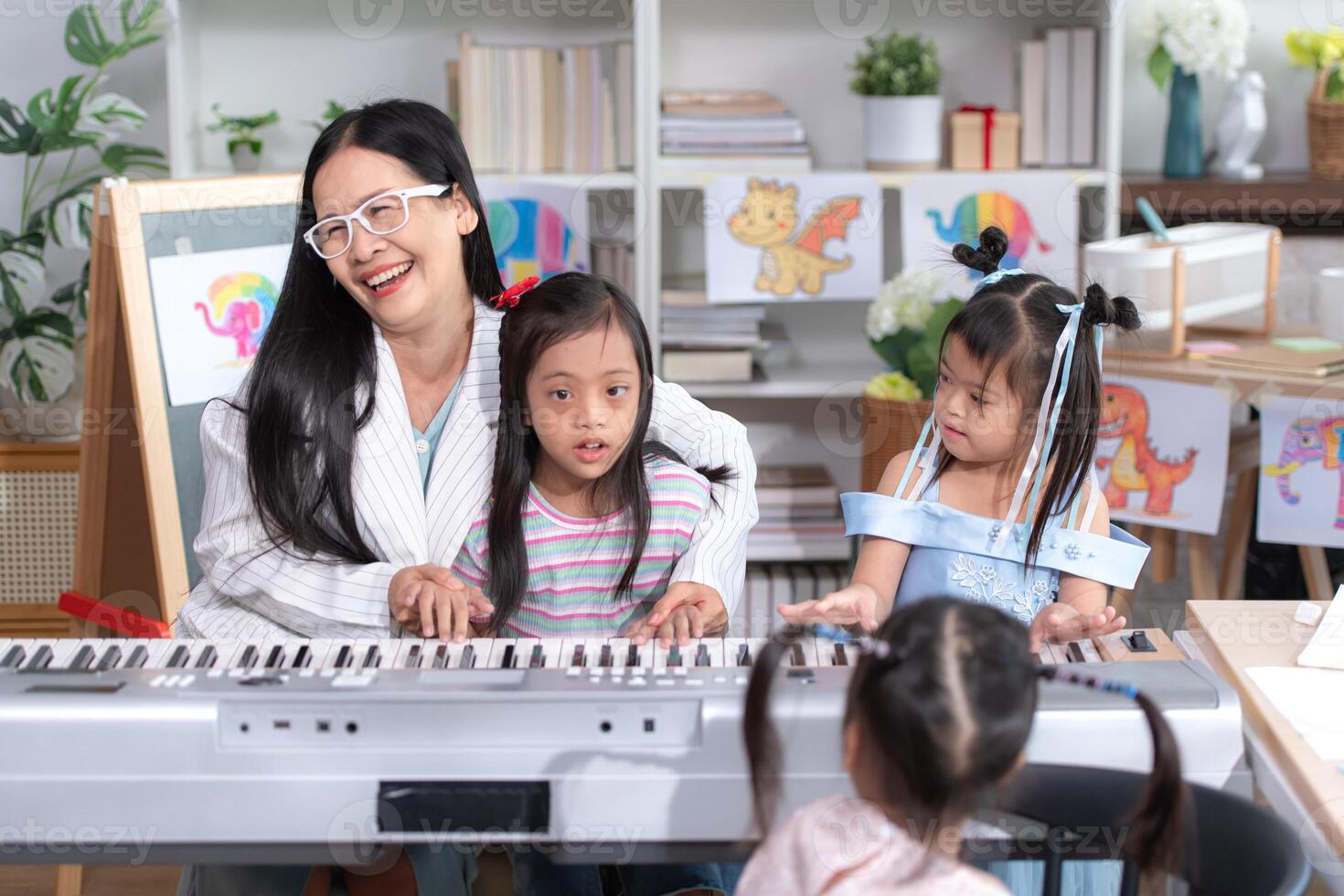 A group of special students doing learning activities in a special classroom photo