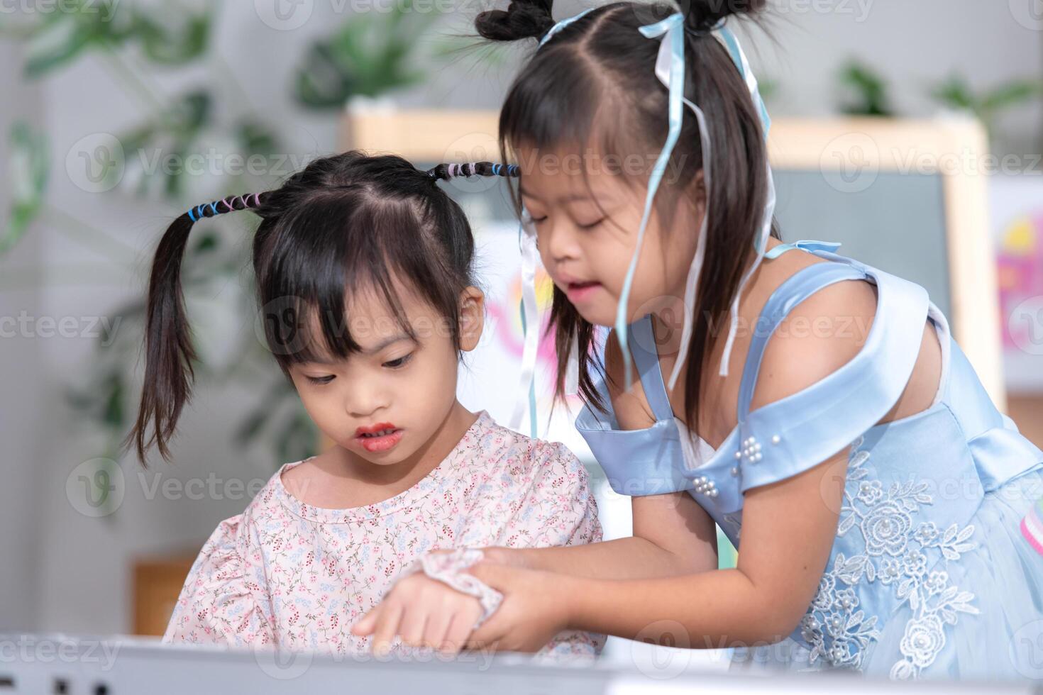 Portrait of special students doing learning activities in a special classroom photo