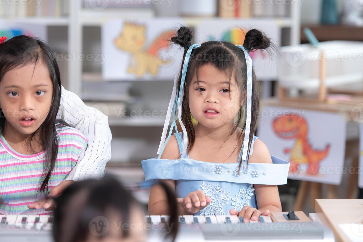 Portrait of special students doing learning activities in a special classroom photo