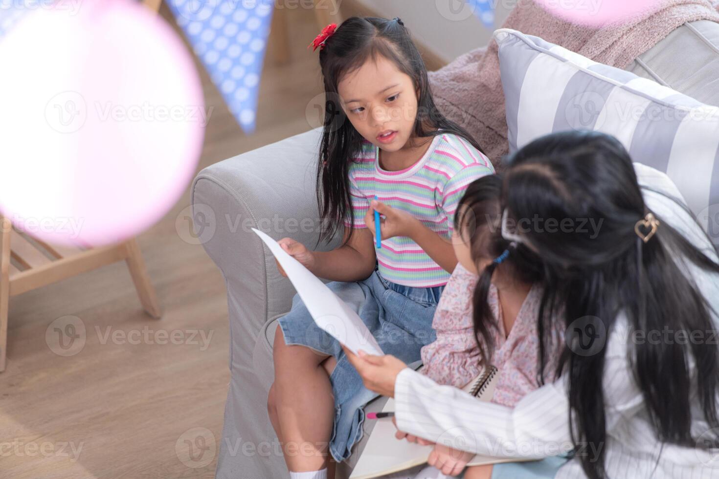 A group of special students doing learning activities in a special classroom photo