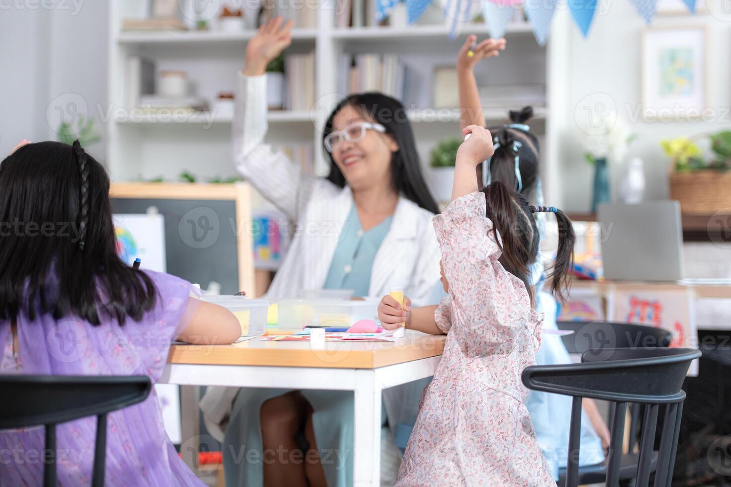 A group of special students doing learning activities in a special classroom photo