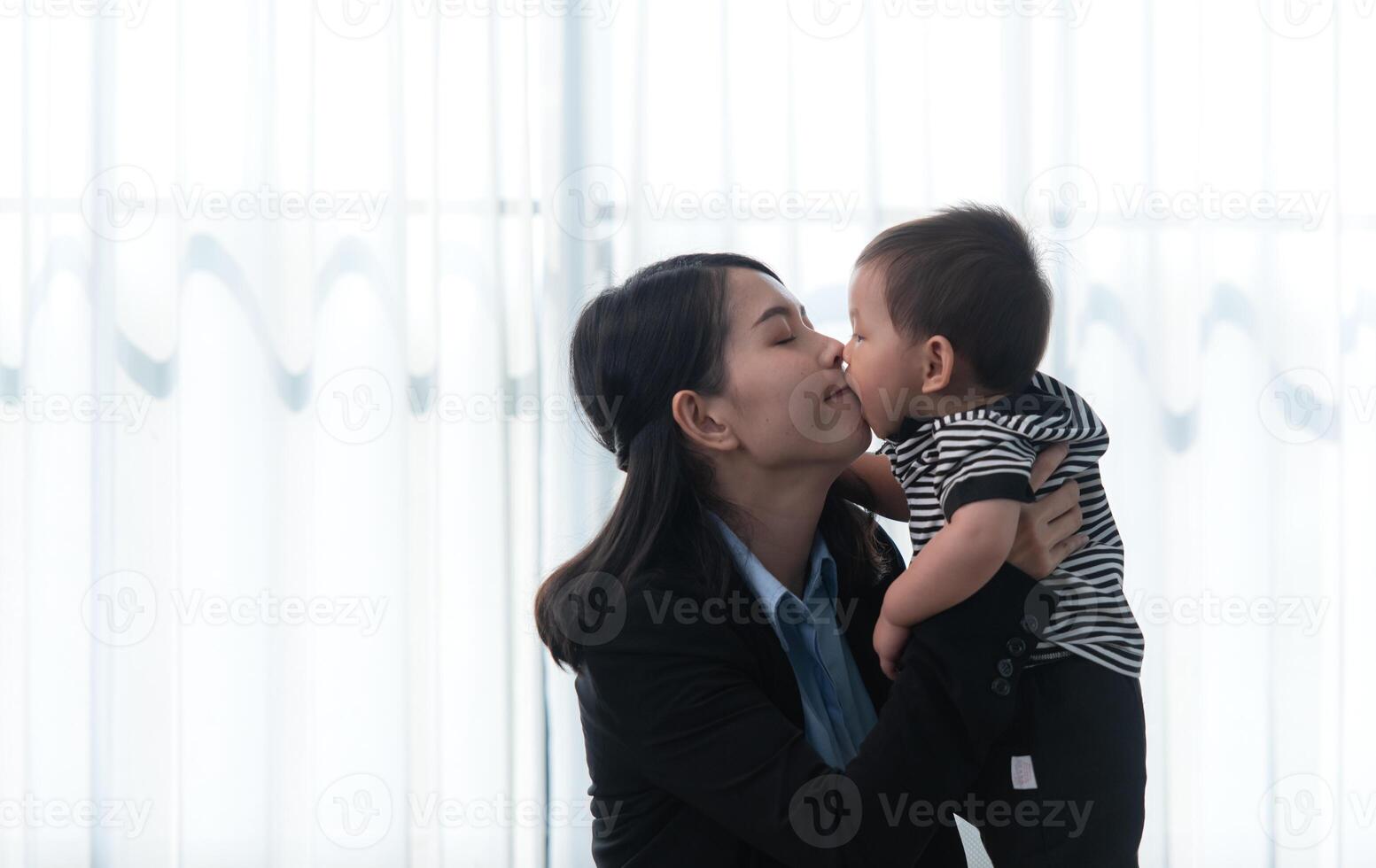 A business mother and his duty to take care of his children while working photo