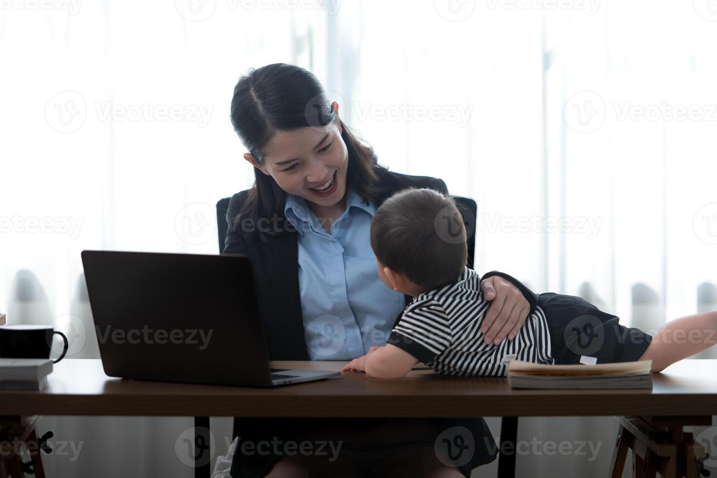 A business mother and his duty to take care of his children while working photo