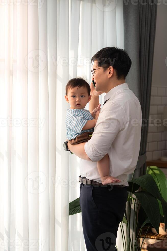 A business father take care children while working photo