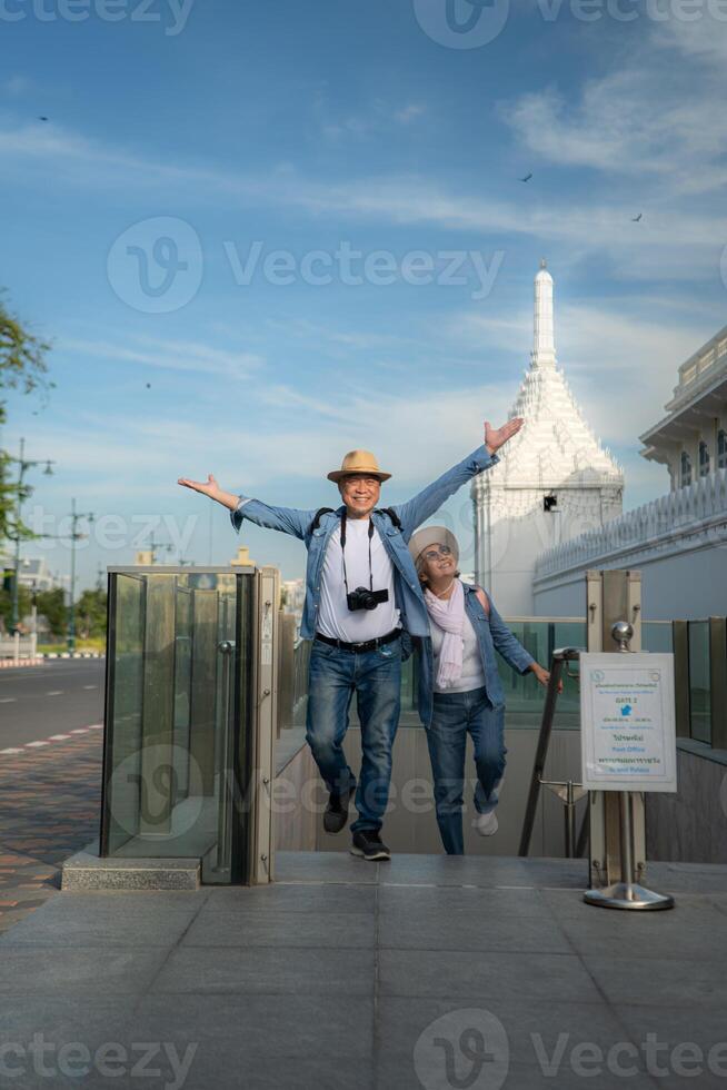 Senior couples' tourist activities around the Grand Palace and Wat Phra Kaew, Thailand photo