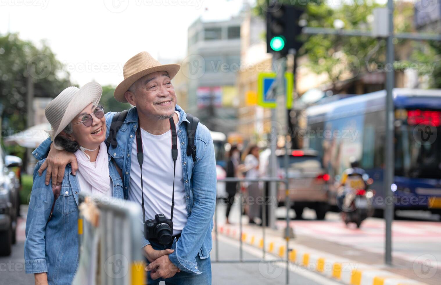 An elderly couple walks around the street in the old city of Bangkok, Thailand. photo