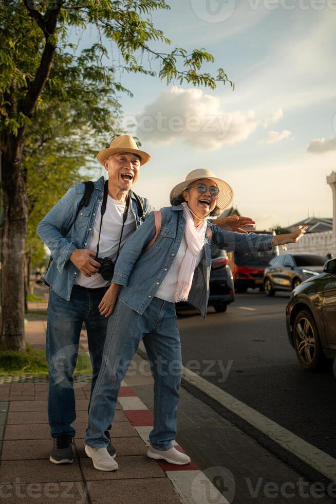 Senior couples' tourist activities around the Grand Palace, Thailand photo